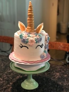 Here is a cute unicorn cake served on a green plate. Fun designs like this can be found at our Dover NH hotel.