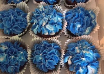 Here are a number of cupcakes Gail created at our Dover NH hotel. They are dark blue and well frosted.