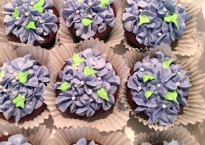 Here is a number of blue flower looking cupcakes served at our Dover NH Hotel.